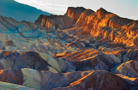 The sun dappled Zabriskie Point at Death Valley National Park.