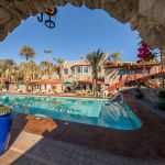 View of Pool Through an Arch