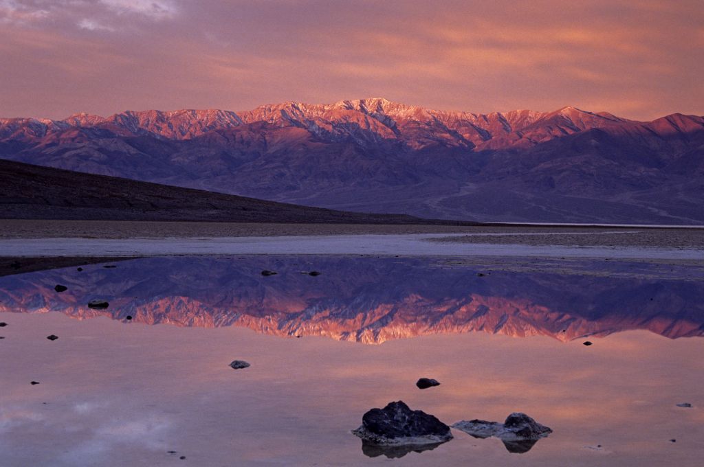 Sunrise colours on Telescope peak reflected in pond at Badwater