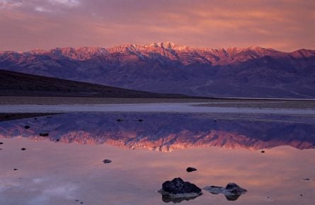 Sunrise colours on Telescope peak reflected in pond at Badwater