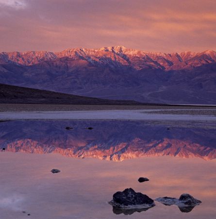 Sunrise colours on Telescope peak reflected in pond at Badwater