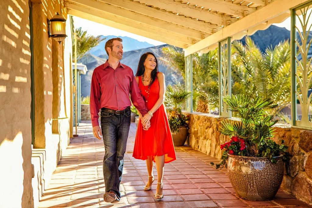 Couple walking down Inn hall