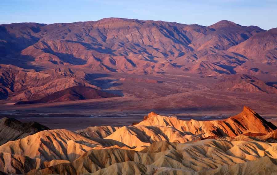 The sun sets over Zabrinski Point in Death Valley National Park.